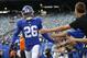 FILE - In this Aug. 16, 2019, file photo, New York Giants running back Saquon Barkley (26) greets fans before an NFL football game against the Chicago Bears in East Rutherford, N.J. Barkley set team rookie records for yards rushing (1,307) receptions (91) and total touchdowns (15) playing behind a bad line. With trade acquisition Kevin Zeitler at right guard, free agent Mike Remmers at right tackle and C Jon Halapio back from from a major leg injury, this could be an even bigger year for the NFL Offensive Rookie of the Year and the league leader in yards from scrimmage (2,028). (AP Photo/Adam Hunger, File)