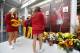 Iowa State cheerleaders look at a memorial to honor slain student Celia Barquin Arozamena, seen in photo at right, before an NCAA college football game between Iowa State and Akron, Saturday, Sept. 22, 2018, in Ames, Iowa. Barquin, who was the 2018 Big 12 women's golf champion and Iowa State Female Athlete of the Year, was found Monday morning in a pond at a golf course near the Iowa State campus. (AP Photo/Charlie Neibergall)