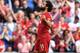 Liverpool's Egyptian midfielder Mohamed Salah celebrates after scoring their second goal from the penalty spot during the English Premier League football match between Liverpool and Arsenal at Anfield in Liverpool, north west England on August 24, 2019. (Photo by Ben STANSALL / AFP) / RESTRICTED TO EDITORIAL USE. No use with unauthorized audio, video, data, fixture lists, club/league logos or 'live' services. Online in-match use limited to 120 images. An additional 40 images may be used in extra time. No video emulation. Social media in-match use limited to 120 images. An additional 40 images may be used in extra time. No use in betting publications, games or single club/league/player publications. / (Photo credit should read BEN STANSALL/AFP/Getty Images)