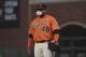 San Francisco Giants' Pablo Sandoval blows a bubble as he stands at first base during a baseball game against the Milwaukee Brewers in San Francisco, Friday, June 14, 2019. (AP Photo/Jeff Chiu)