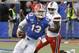Florida quarterback Feleipe Franks (13) scrambles as he is pressured by Miami linebacker Shaquille Quarterman, right, during the first half of an NCAA college football game Saturday, Aug. 24, 2019, in Orlando, Fla. (AP Photo/John Raoux)