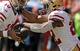 San Francisco 49ers quarterback Jimmy Garoppolo (10) fakes a handoff to running back Matt Breida (22) during the first half of an NFL football game against the Kansas City Chiefs in Kansas City, Mo., Sunday, Sept. 23, 2018. (AP Photo/Charlie Riedel)
