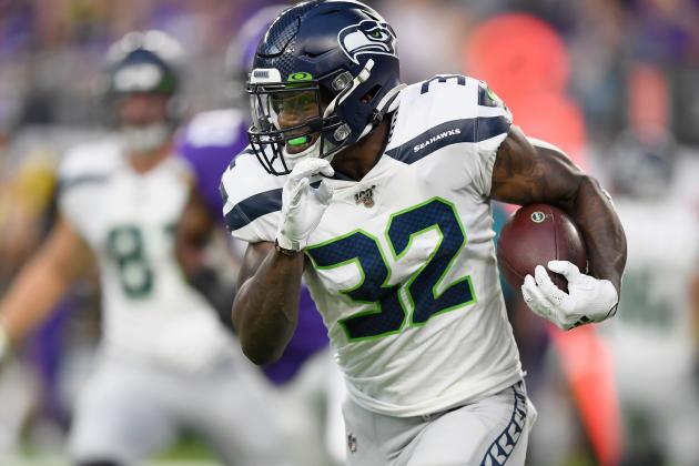 MINNEAPOLIS, MN - AUGUST 18: Chris Carson #32 of the Seattle Seahawks carries the ball against the Minnesota Vikings during the first quarter of the preseason game at U.S. Bank Stadium on August 18, 2019 in Minneapolis, Minnesota. (Photo by Hannah Foslien/Getty Images)