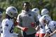 New England Patriots wide receiver Demaryius Thomas, center, warms up with teammates during an NFL football training camp practice, Thursday, July 25, 2019, in Foxborough, Mass. (AP Photo/Steven Senne)