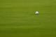PORTRUSH, NORTHERN IRELAND - JULY 20: The ball of Jon Rahm of Spain sits on the edge of the hole on the 18th green during the third round of the 148th Open Championship held on the Dunluce Links at Royal Portrush Golf Club on July 20, 2019 in Portrush, United Kingdom. (Photo by Francois Nel/Getty Images)