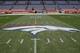 The Denver Broncos logo is painted on the field at Mile High Stadium prior to an NFL football game against the Los Angeles Chargers, Monday, Sept. 11, 2017, in Denver. (AP Photo/Jack Dempsey)