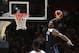 United States' Donovan Mitchell jumps up to dunk the ball against Canada during their exhibition basketball game in Sydney, Australia, Monday, Aug. 26, 2019. (AP Photo/Rick Rycroft)