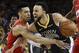 Golden State Warriors guard Stephen Curry, right, is defended by Toronto Raptors guard Danny Green during the second half of Game 4 of basketball's NBA Finals Friday, June 7, 2019, in Oakland, Calif. (AP Photo/Ben Margot)