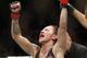 Cris Cyborg celebrates after defeating Holly Holm during a featherweight championship mixed martial arts bout at UFC 219, Saturday, Dec. 30, 2017, in Las Vegas. (AP Photo/John Locher)