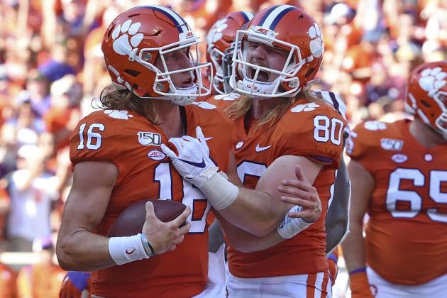Clemson's Trevor Lawrence, left, and Luke Price celebrate Lawrence's touchdown during the first half of an NCAA college football game against Texas A&M, Saturday, Sept. 7, 2019, in Clemson, S.C. (AP Photo/Richard Shiro)