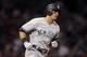 New York Yankees' Mike Tauchman rounds first base on nis two-run home run during the fourth inning of a baseball game against the Boston Red Sox in Boston, Sunday, Sept. 8, 2019. (AP Photo/Michael Dwyer)