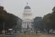 The California state Capitol is viewed through the smoke from the Camp Fire, Tuesday, Nov. 13, 2018, in Sacramento, Calif. Smoke from the Camp Fire, which has been burning since last Thursday nearly 90 miles north of Sacramento, has blanketed much of Northern California. The has has destroyed thousands of homes and killed dozens of people. (AP Photo/Rich Pedroncelli)