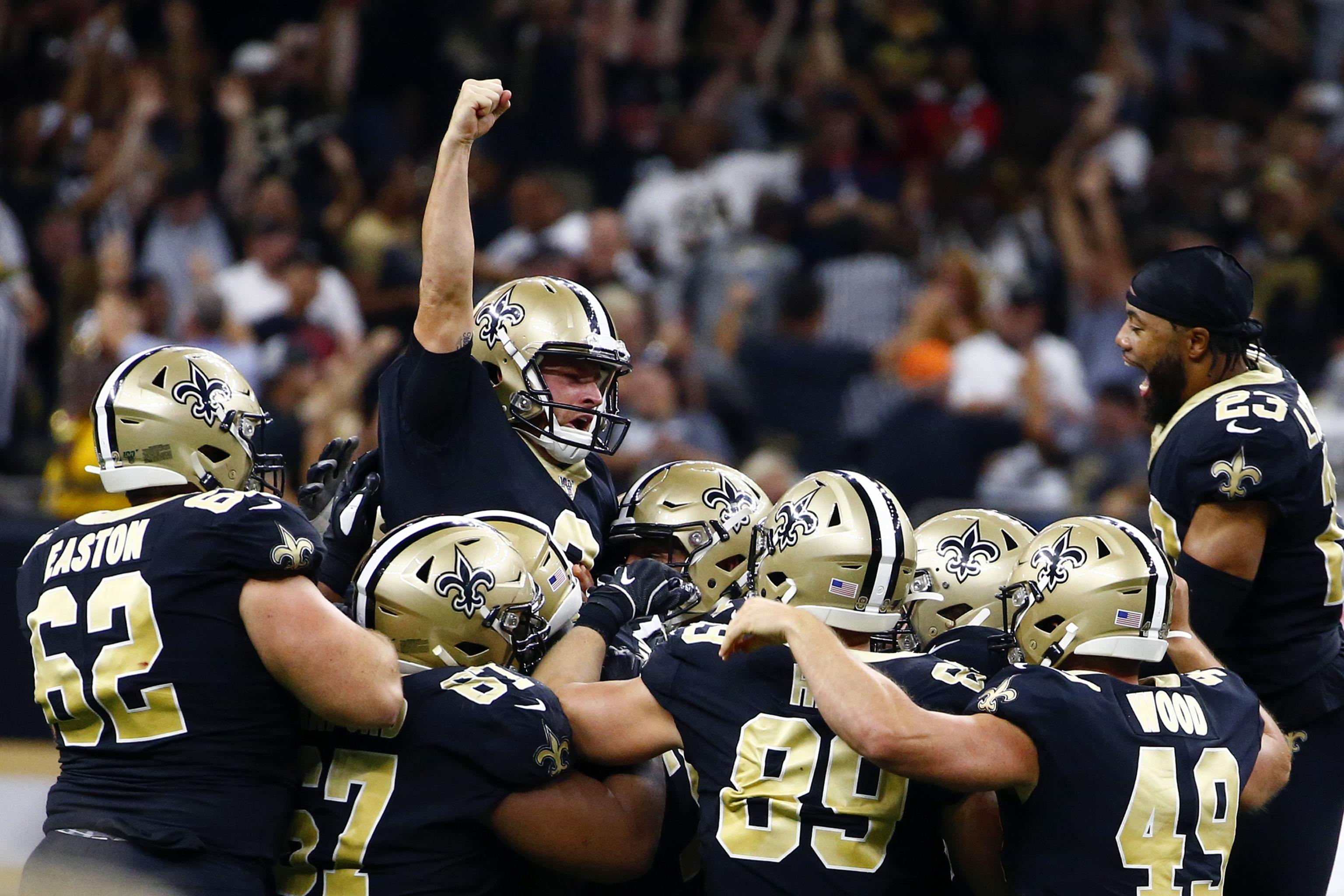 A detail shot of New Orleans Saints quarterback Drew Brees #9 cleats as he  walks on the field between plays against the Las Vegas Raiders during an  NFL football game, Monday, Sept.