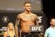 Dustin Poirier poses for photographers during a weigh-in before UFC 211 on Friday, May 12, 2017, in Dallas before UFC 211. ( AP Photo/Gregory Payan)
