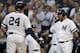 NEW YORK, NY - SEPTEMBER 3: Gary Sanchez #24 of the New York Yankees is congratulated after hitting a two run home run by Edwin Encarnacion #30 during the first against the Texas Rangers inning at Yankee Stadium on September 3, 2019 in the Bronx borough of New York City. (Photo by Adam Hunger/Getty Images)