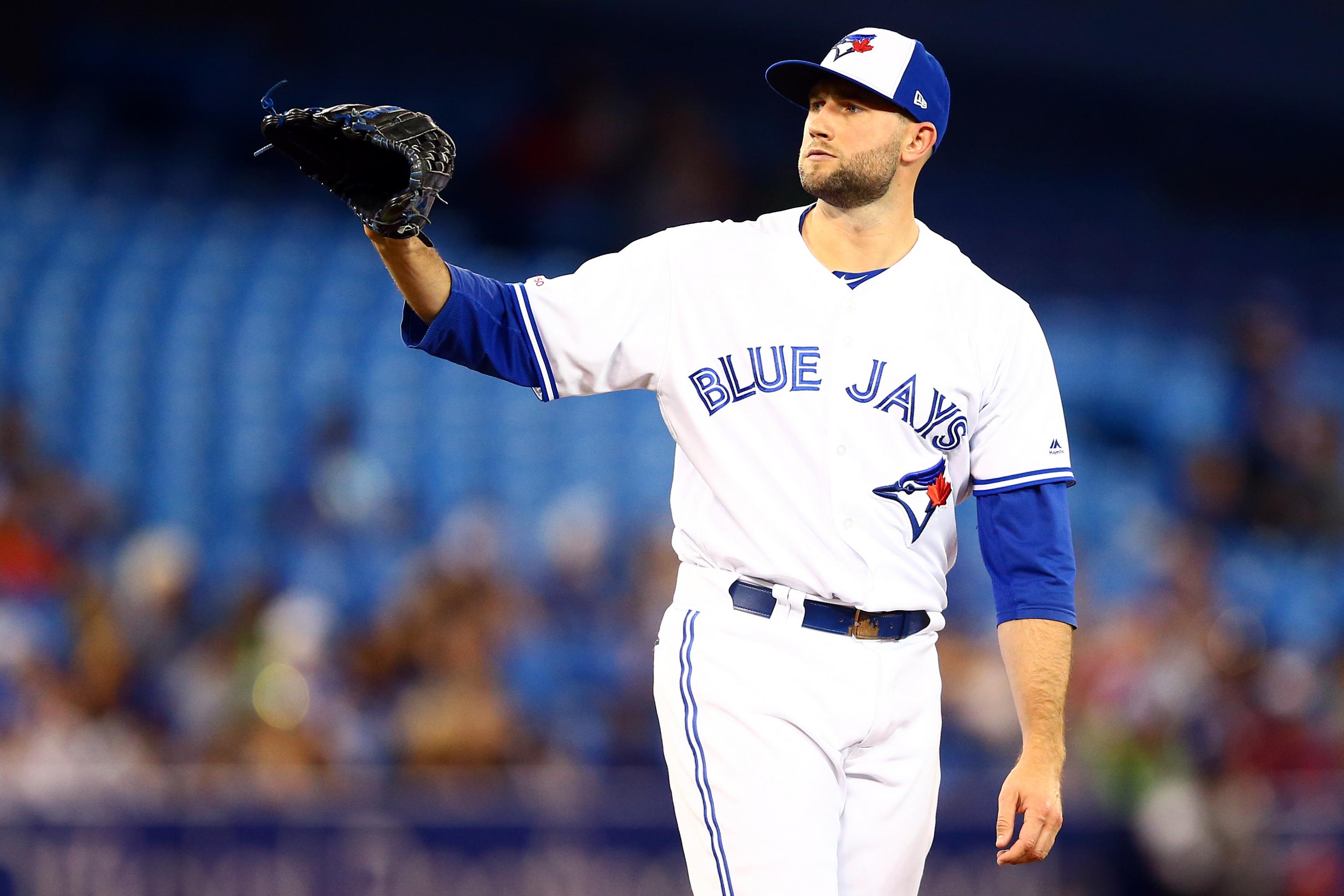 Toronto Blue Jays' iron-man pitcher late arriving for spring