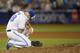 TORONTO, ON - SEPTEMBER 13: Tim Mayza #58 of the Toronto Blue Jays drops to his knees with an injury during tenth inning of their MLB game against the New York Yankees at Rogers Centre on September 13, 2019 in Toronto, Canada. (Photo by Cole Burston/Getty Images)