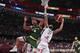 Matthew Dellavedova of Australia and Rudy Gobert of France battle the ball during their third placing match for the FIBA Basketball World Cup at the Cadillac Arena in Beijing, Saturday, Sept. 13, 2019. (AP Photo/Ng Han Guan)