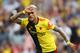 WATFORD, ENGLAND - SEPTEMBER 15: Roberto Pereyra of Watford celebrates as he scores his team's second goal from a penalty during the Premier League match between Watford FC and Arsenal FC at Vicarage Road on September 15, 2019 in Watford, United Kingdom. (Photo by Marc Atkins/Getty Images)