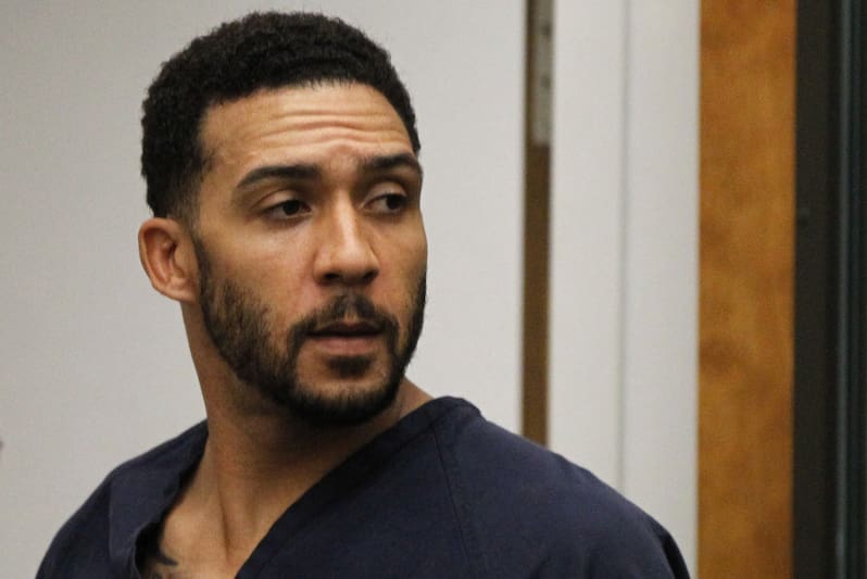 FILE - In this June 15, 2018, file photo, former NFL football player Kellen Winslow Jr., center, leaves his arraignment in Vista, Calif. Winslow, a former NFL No. 1 draft pick and son of a Hall of Famer who starred for his hometown San Diego Chargers, goes on trial Monday, May 20, 2019, on multiple charges including raping two women last year and raping an unconscious 17-year-old girl. He has pleaded not guilty to all charges.(Hayne Palmour/San Diego Union-Tribune via AP, Pool, File)