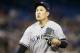 TORONTO, ON - SEPTEMBER 13: Masahiro Tanaka #19 of the New York Yankees walks back to the dugout at the end of the fourth inning of their MLB game against the Toronto Blue Jays at Rogers Centre on September 13, 2019 in Toronto, Canada. (Photo by Cole Burston/Getty Images)