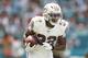 MIAMI, FLORIDA - SEPTEMBER 15: Kenyan Drake #32 of the Miami Dolphins runs with the ball against the New England Patriots at Hard Rock Stadium on September 15, 2019 in Miami, Florida. (Photo by Michael Reaves/Getty Images)