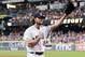 Houston Astros starting pitcher Gerrit Cole waves to the crowd as he leaves the mound after striking out Texas Rangers designated hitter Shin-Soo Choo for his 300th season strikeout during the sixth inning of a baseball game Wednesday, Sept. 18, 2019, in Houston. (AP Photo/Michael Wyke)