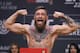 FILE - In this Oct. 5, 2018, file photo, Conor McGregor poses during a ceremonial weigh-in for the UFC 229 mixed martial arts fight in Las Vegas. Superstar UFC fighter McGregor has announced on social media that he is retiring from mixed martial arts. McGregor’s verified Twitter account had a post early Tuesday, March 26, 2019, that said the former featherweight and lightweight UFC champion was making a “quick announcement.”(AP Photo/John Locher, File)