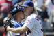 New York Mets starting pitcher Noah Syndergaard, right, hugs catcher Wilson Ramos after they defeated the Cincinnati Reds 1-0 during a baseball game, Thursday, May 2, 2019, in New York. (AP Photo/Julio Cortez)