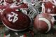Alabama helmets lay with confetti after overtime of the NCAA college football playoff championship game against Georgia Monday, Jan. 8, 2018, in Atlanta. Alabama won 26-23. (AP Photo/David J. Phillip)