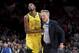 Golden State Warriors forward Kevin Durant, left, helps escort coach Steve Kerr after Kerr was ejected during the second half of the team's NBA basketball game against the Portland Trail Blazers in Portland, Ore., Wednesday, Feb. 13, 2019. The Blazers won 129-107. (AP Photo/Steve Dykes)