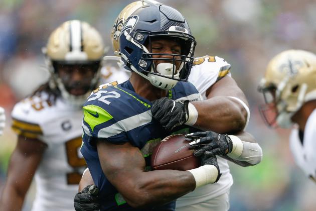 SEATTLE, WA - SEPTEMBER 22:  Running back Chris Carson #32 of the Seattle Seahawks rushes against defensive tackle David Onyemata #93 of the New Orleans Saints at CenturyLink Field on September 22, 2019 in Seattle, Washington.  (Photo by Otto Greule Jr/Getty Images)