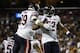 Chicago Bears linebackers Aaron Lynch (99) and Khalil Mack (52) celebrate Mack's hit to cause a fumble by the Washington Redskins during the first half of an NFL football game Monday, Sept. 23, 2019, in Landover, Md. (AP Photo/Patrick Semansky)
