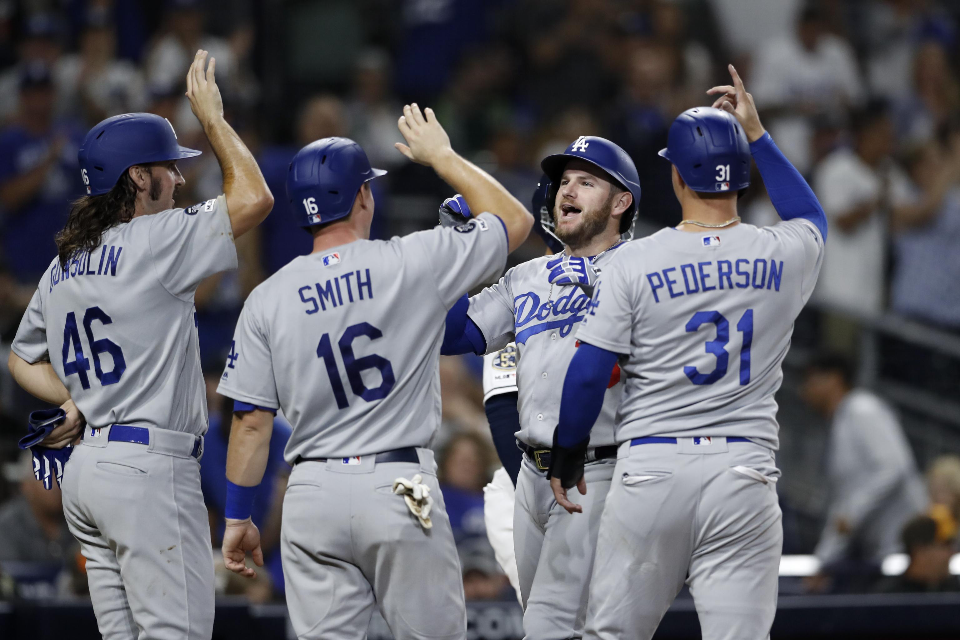 Baseball playoffs: Dodgers clinch top NL seed, Braves claim NL