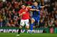 Manchester United's Welsh midfielder Daniel James (L) vies with Rochdale's Welsh defender Rhys Norrington-Davies (R) during the English League Cup third round football match between Manchester United and Rochdale at Old Trafford in Manchester, north-west England on September 25, 2019. (Photo by Paul ELLIS / AFP) / RESTRICTED TO EDITORIAL USE. No use with unauthorized audio, video, data, fixture lists, club/league logos or 'live' services. Online in-match use limited to 120 images. An additional 40 images may be used in extra time. No video emulation. Social media in-match use limited to 120 images. An additional 40 images may be used in extra time. No use in betting publications, games or single club/league/player publications. / (Photo credit should read PAUL ELLIS/AFP/Getty Images)