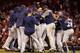 Milwaukee Brewers celebrate after defeating the St. Louis Cardinals 2-1 in a baseball game Wednesday, Sept. 26, 2018, in St. Louis. The win clinched a postseason spot for the Brewers. (AP Photo/Jeff Roberson)