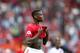Manchester United's Paul Pogba leaves the pitch at the end of the English Premier League soccer match between Manchester United and Crystal Palace at Old Trafford in Manchester, England Saturday, Aug, 24, 2019. (AP Photo/Alastair Grant)