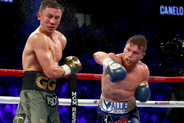 LAS VEGAS, NV - SEPTEMBER 16:  (R-L) Canelo Alvarez throws a punch at Gennady Golovkin during their WBC, WBA and IBF middleweight championship bout at T-Mobile Arena on September 16, 2017 in Las Vegas, Nevada.  (Photo by Al Bello/Getty Images)