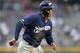 DENVER, COLORADO - SEPTEMBER 27: Trent Grisham #2 of the Milwaukee Brewers scores on a Ryan Braun single in the first inning against the Colorado Rockies at Coors Field on September 27, 2019 in Denver, Colorado. (Photo by Matthew Stockman/Getty Images)