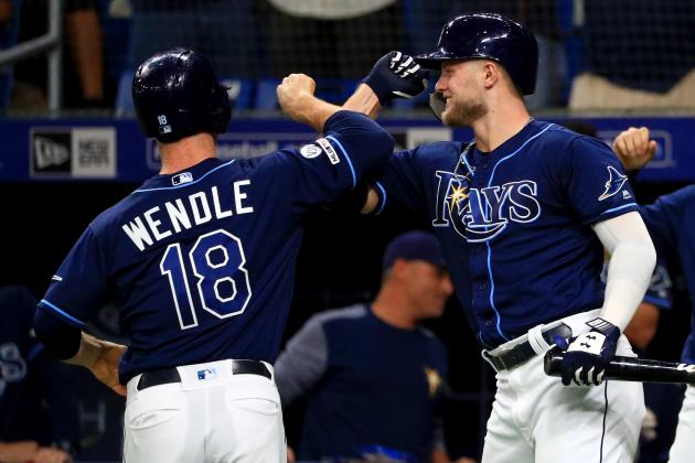 ST PETERSBURG, FLORIDA - SEPTEMBER 25: Joey Wendle #18 of the Tampa Bay Rays is congratulated after hitting a home run in the first inning by Austin Meadows #17 during a game against the New York Yankees at Tropicana Field on September 25, 2019 in St Petersburg, Florida. (Photo by Mike Ehrmann/Getty Images)