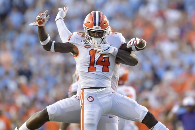 CHAPEL HILL, NORTH CAROLINA - SEPTEMBER 28: Denzel Johnson #14 and Nyles Pinckney #44 of the Clemson Tigers celebrate after stopping a two-point conversion attempt by the North Carolina Tar Heels during the fourth quarter of their game at Kenan Stadium on September 28, 2019 in Chapel Hill, North Carolina. Clemson won 21-20. (Photo by Grant Halverson/Getty Images)