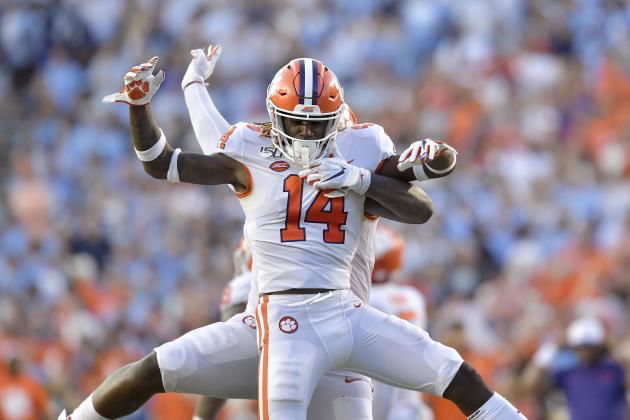 CHAPEL HILL, NORTH CAROLINA - SEPTEMBER 28: Denzel Johnson #14 and Nyles Pinckney #44 of the Clemson Tigers celebrate after stopping a two-point conversion attempt by the North Carolina Tar Heels during the fourth quarter of their game at Kenan Stadium on September 28, 2019 in Chapel Hill, North Carolina. Clemson won 21-20. (Photo by Grant Halverson/Getty Images)