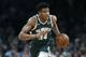 Milwaukee Bucks' Giannis Antetokounmpo brings the ball up court during the first half of Game 4 of a second round NBA basketball playoff series against the Boston Celtics in Boston, Monday, May 6, 2019. (AP Photo/Michael Dwyer)