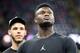 NEW ORLEANS, LOUISIANA - SEPTEMBER 09: NBA players, Zion Williamson (front) and Lonzo Ball of the New Orleans Pelicans walk on the field before the game between the New Orleans Saints and the Houston Texans at Mercedes Benz Superdome on September 09, 2019 in New Orleans, Louisiana. (Photo by Chris Graythen/Getty Images)