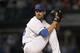 Chicago Cubs starting pitcher Cole Hamels winds up during the first inning of a baseball game against the Cincinnati Reds, Monday, Sept. 16, 2019, in Chicago. (AP Photo/Charles Rex Arbogast)