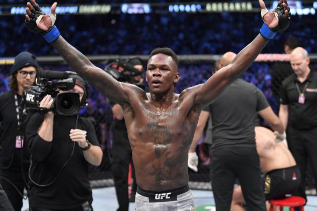 MELBOURNE, AUSTRALIA - OCTOBER 06:  Israel Adesanya of Nigeria celebrates after his knockout victory over Robert Whittaker of New Zealand in their UFC middleweight championship fight during the UFC 243 event at Marvel Stadium on October 06, 2019 in Melbourne, Australia. (Photo by Jeff Bottari/Zuffa LLC/Zuffa LLC via Getty Images)