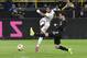 Germany's Serge Gnabry, left, takes a shot at goal next to Argentina's Nicolas Tagliafico during the international friendly soccer match between Germany and Argentina at the Signal Iduna Park stadium in Dortmund, Germany, Wednesday, Oct. 9, 2019. (AP Photo/Martin Meissner)
