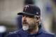 Minnesota Twins bench coach Derek Shelton is seen in the dugout during a baseball game against the Detroit Tigers, Friday, Aug. 30, 2019, in Detroit. (AP Photo/Carlos Osorio)