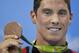 United States' Conor Dwyer shows off his bronze medal during the medal ceremony for the men's 200-meter freestyle final during the swimming competitions at the 2016 Summer Olympics, Monday, Aug. 8, 2016, in Rio de Janeiro, Brazil. (AP Photo/Michael Sohn)