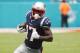 FILE - In this Sunday, Sept. 15, 2019, file photo, New England Patriots wide receiver Antonio Brown (17) carries the ball during the first half at an NFL football game against the Miami Dolphins in Miami Gardens, Fla. Brown has indicated he's not retiring from the NFL, only a few days after announcing he was done with the league in a Twitter rant. Brown, who was released by the Patriots last week after playing only one game, says he'll practice at high schools one day a week, starting in Miami. (AP Photo / Wilfredo Lee, File)